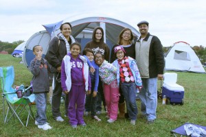 A family poses in front of their tent at Carousel Park. (Photo provided by New Castle County Government)