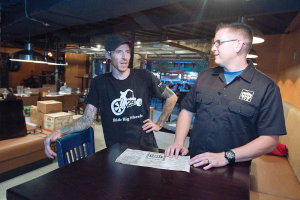 Jones confers with Donovan Brown, executive chef at the Tap House. (Photo by Tim Hawk)