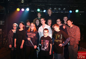Eric Svalgard (back row) and some of his students. Unlike traditional bands, School of Rock students have to learn how to play with everyone. (Photo by Tim Hawk)