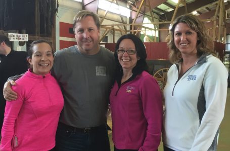 Sugrue with, from left, Lisa Breedlove, director of operations for northern locations, Holly Monaco, vice president & COO, and Amy Polend, director of operations for southern locations. (Photo courtesy of Eric Sugrue)