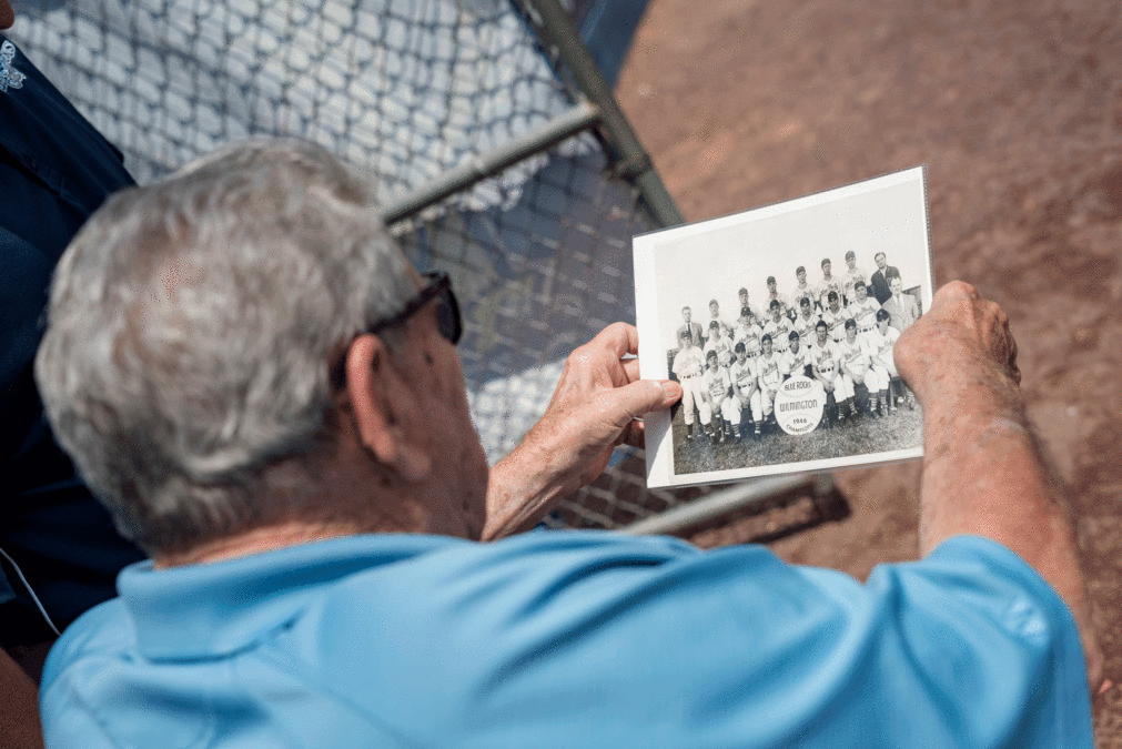 Crimian checks out a photo of the 1946 champion Blue Rocks, the team he broke in with. The Blue Rocks staff bought the photo on Ebay and presented it to him during the photo shoot at Frawley Stadium. Photo Jim Coarse