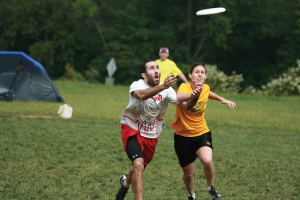 Alex Grintsvayg and Kristen Frentzel fight for the disc during a game. (Photo by Matt Jones)