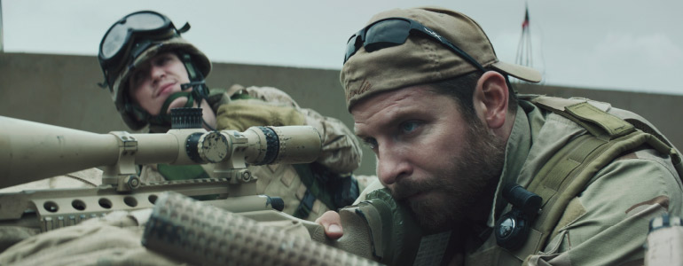 (L-r) Kyle Gallner as Goat-Winston and Bradley Cooper as Chris Kyle in American Sniper. Photo courtesy of Warner Bros. Pictures.