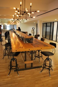 Herrera installed this custom-made 28-foot-long table, made from American chestnut, and outfitted it with electrical and internet connections for 18 users. (Photo by Joe del Tufo)